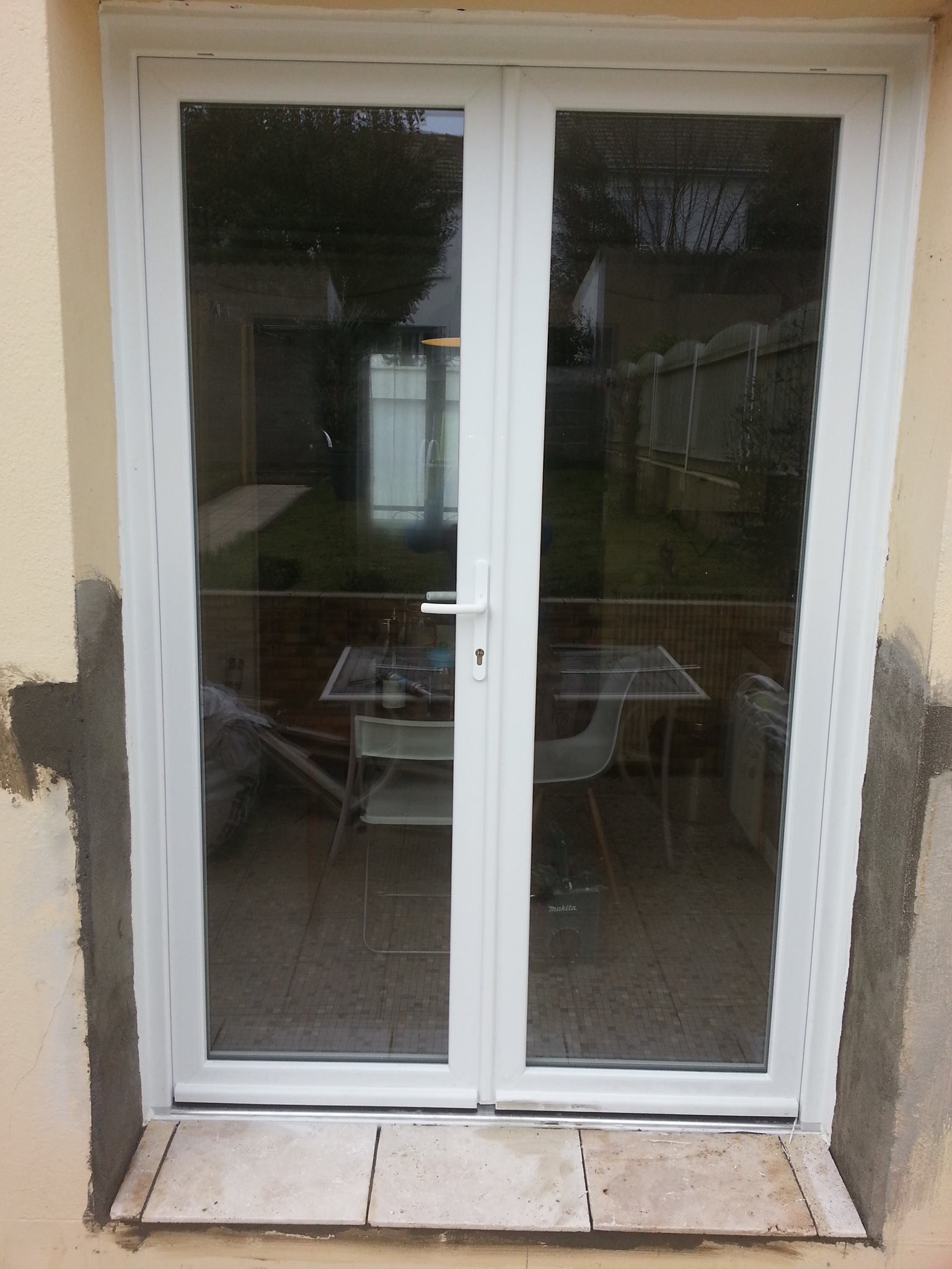 Porte-fenêtre PVC double vantaux